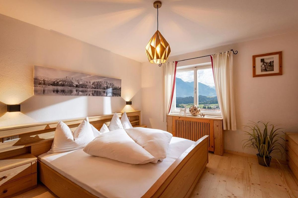 Bedroom with a double bed and a view of the mountains