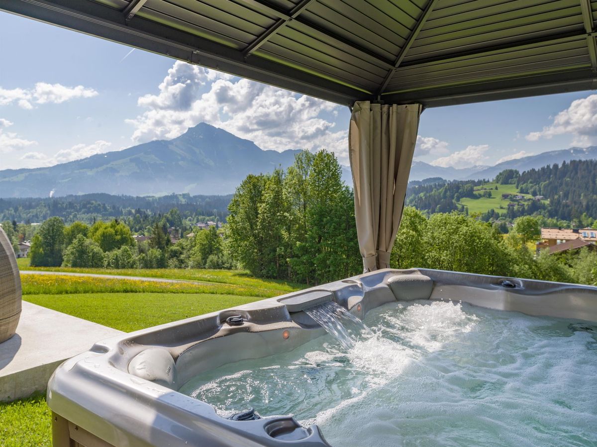 The whirlpool under its roof with a mountain view